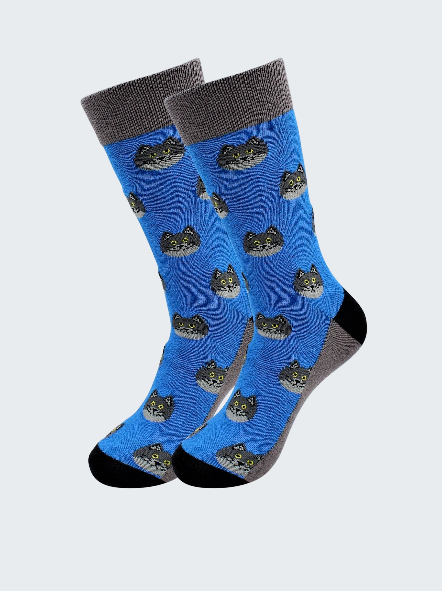 Pair of blue socks with cat pattern on a white background
