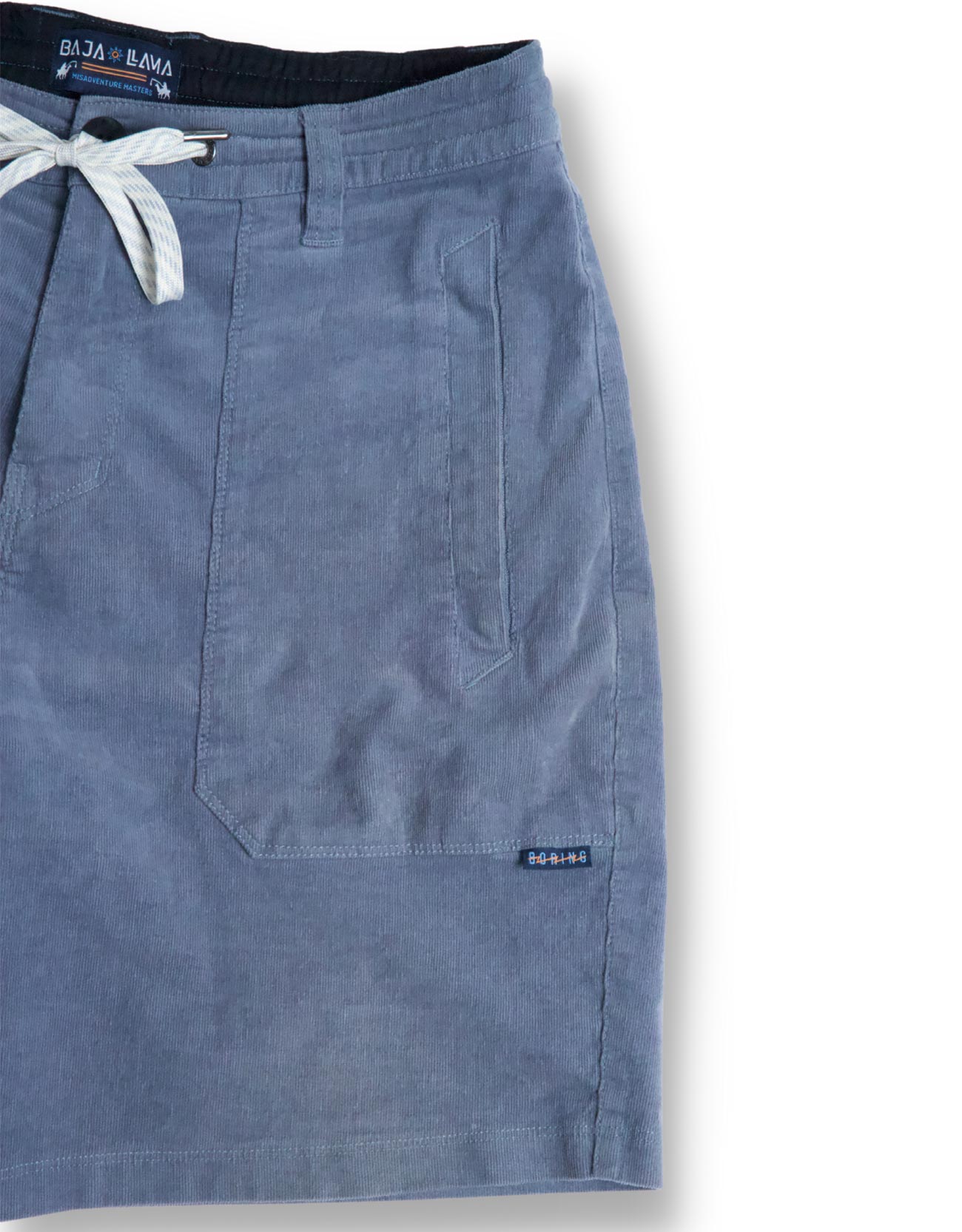 Blue shorts with a brand label on a light gray background