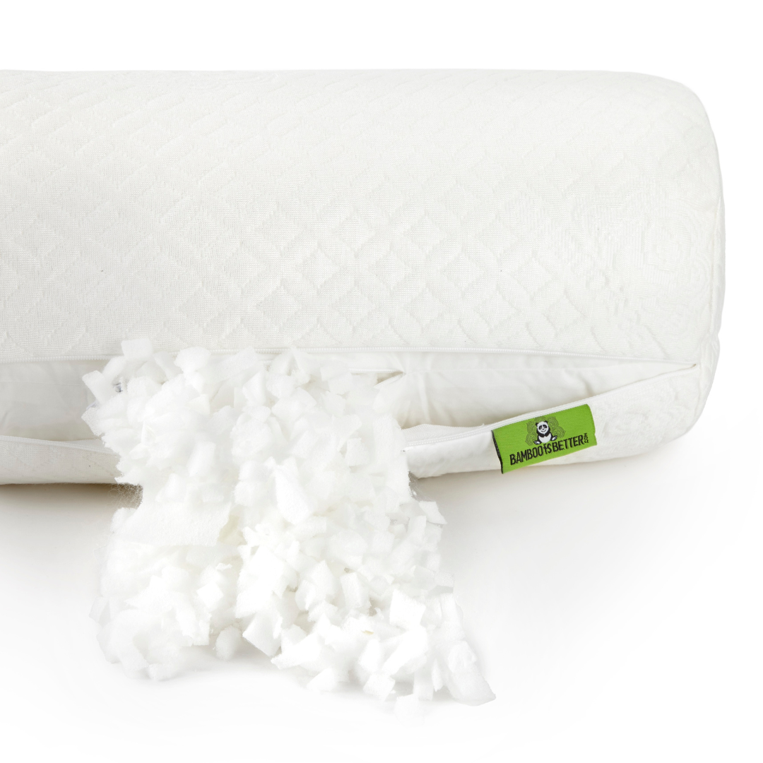 White pillow with a fluffy white cover and a green label on a white background