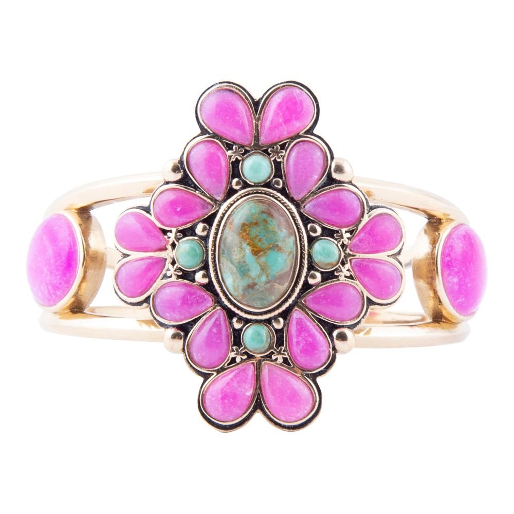 Decorative ring with pink and turquoise stones on a white background