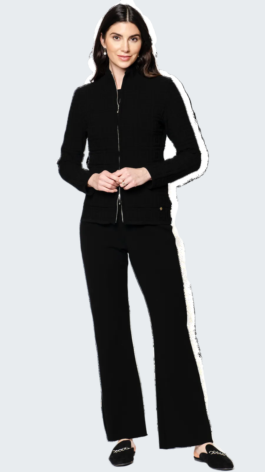 Woman wearing a black outfit on a white background
