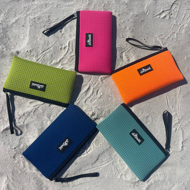 Five colorful pouches with a brand logo on a textured surface