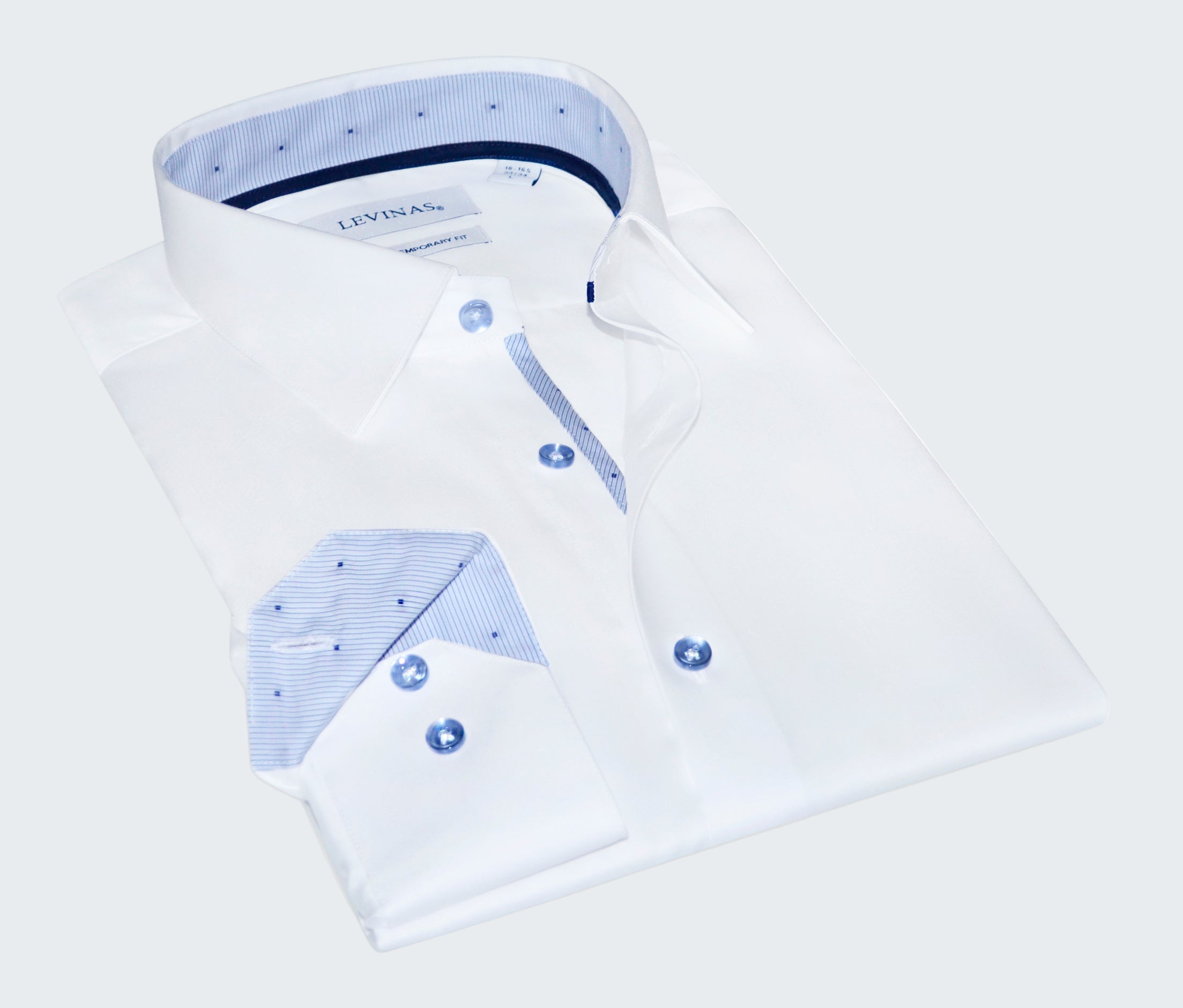 Folded white dress shirt with blue accents and Levi's branding on a white background