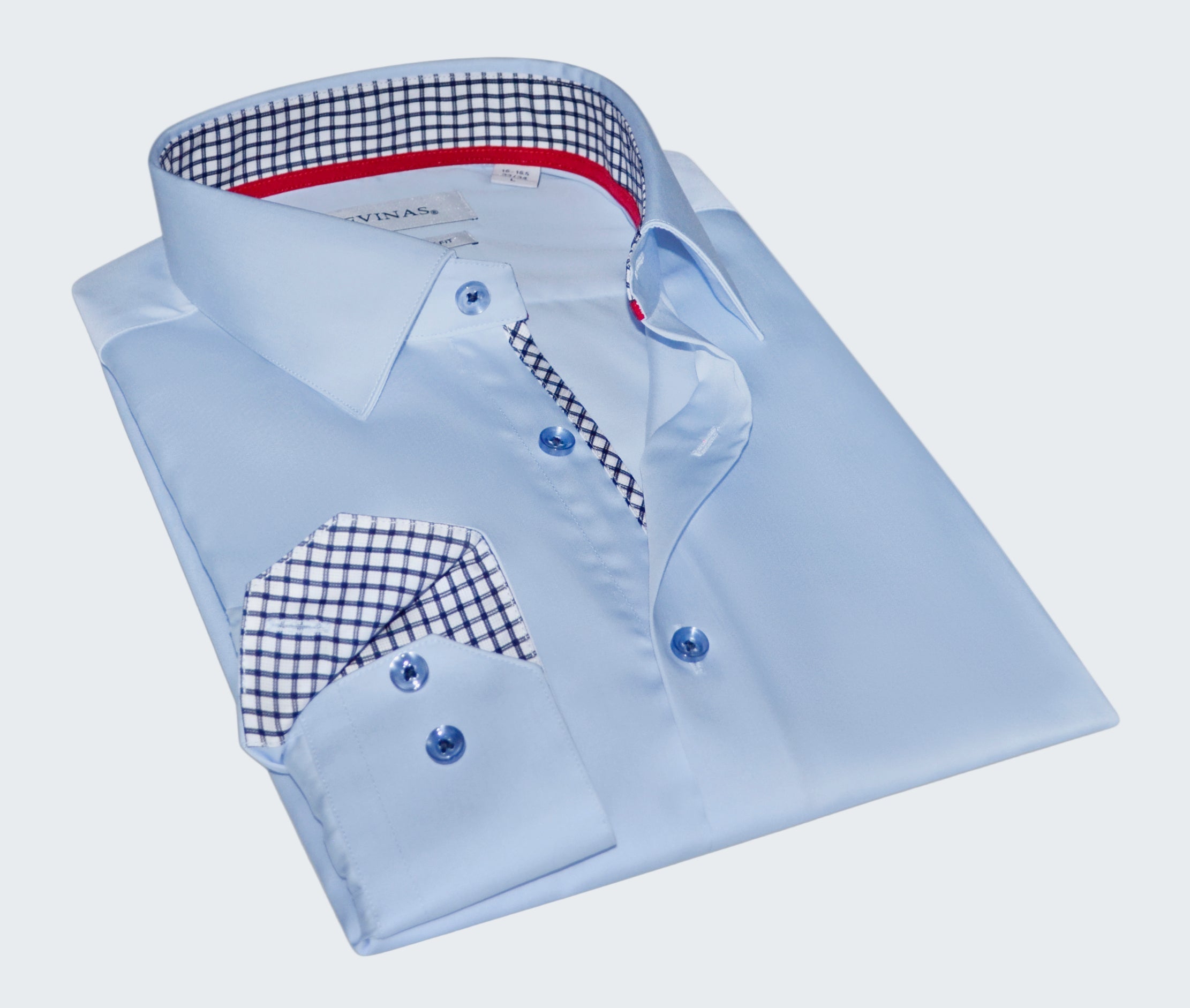 Folded light blue dress shirt with checkered details on a white background