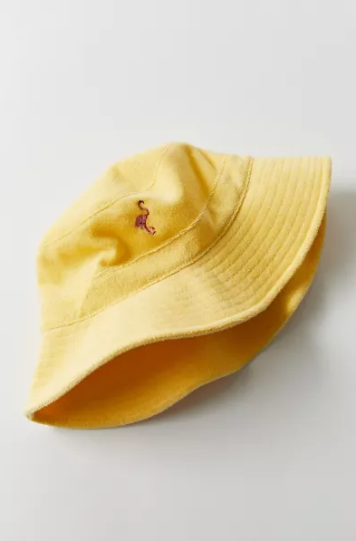 Yellow bucket hat with a logo on a light gray background
