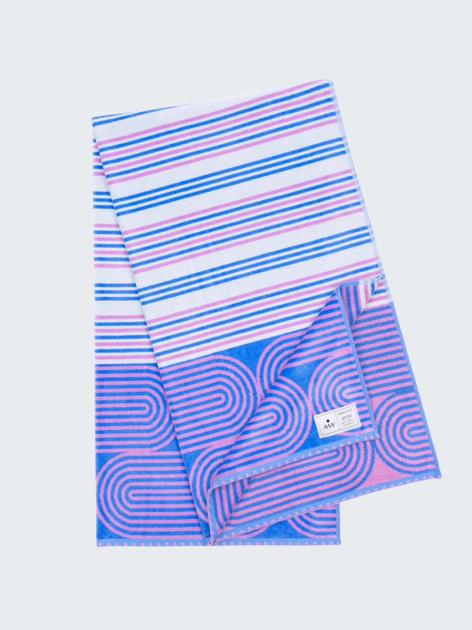 Striped towel with blue and pink patterns on a white background