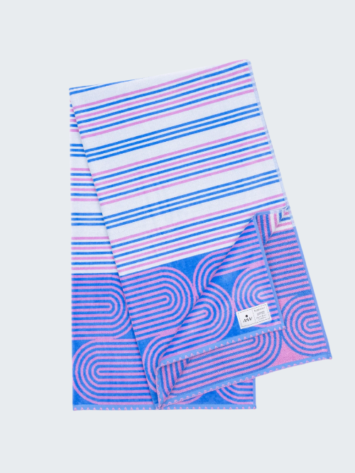 Striped towel with blue and pink patterns on a white background