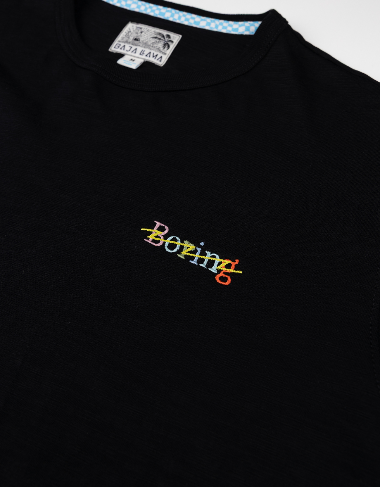 Black t-shirt with colorful 'Boeing' text on a white background