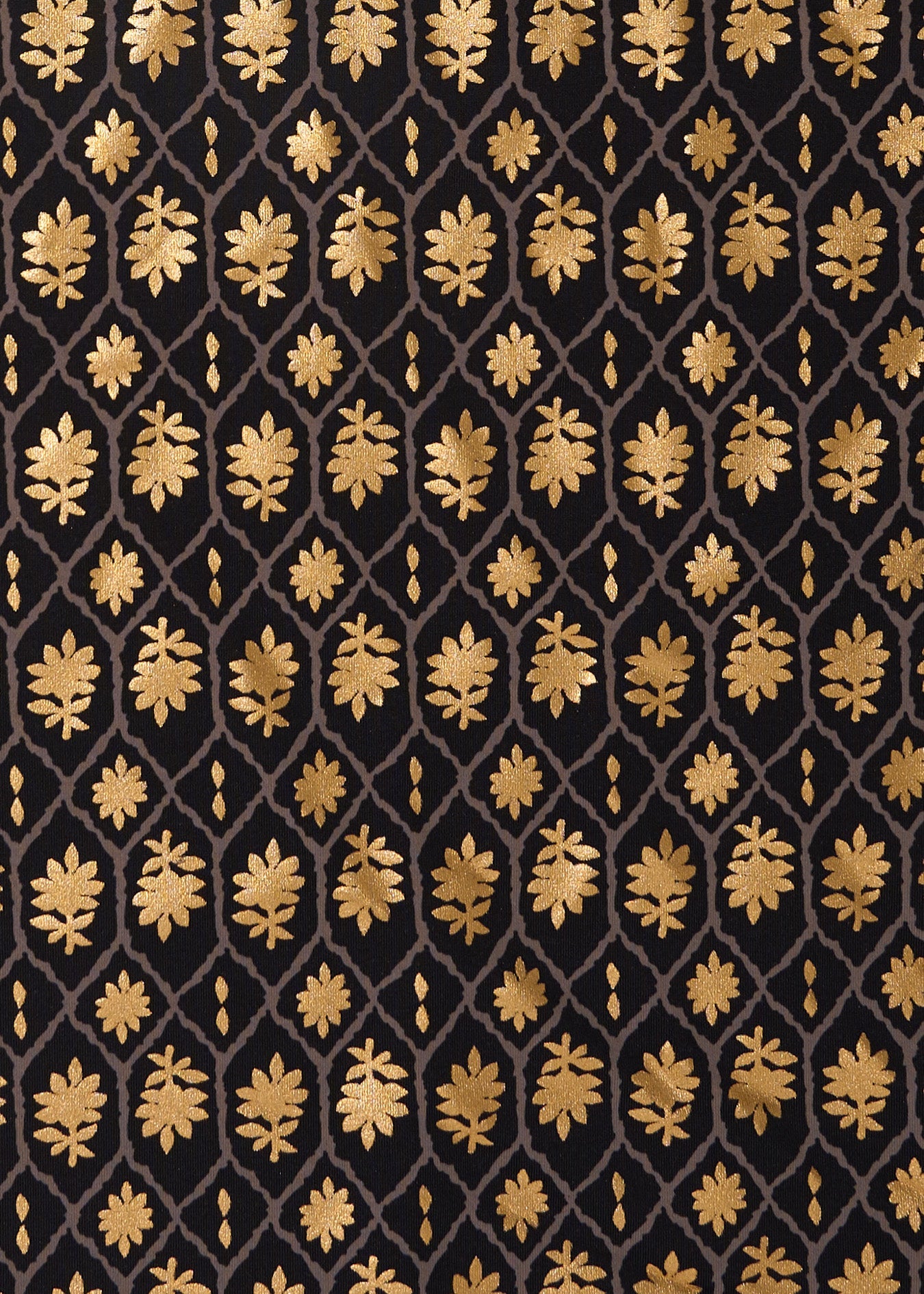 Gold leaf pattern on a black background