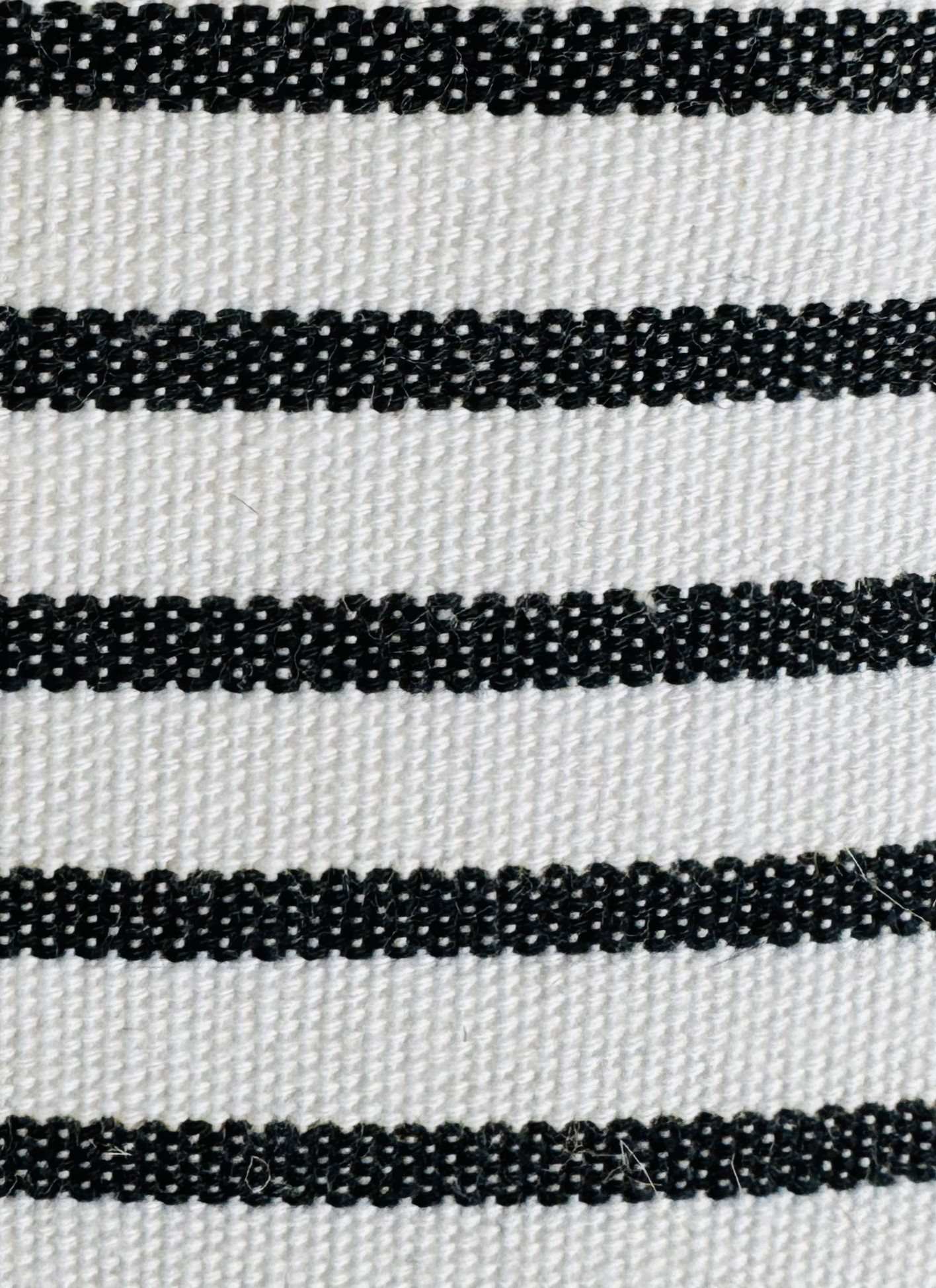 Close-up of black and white striped fabric texture