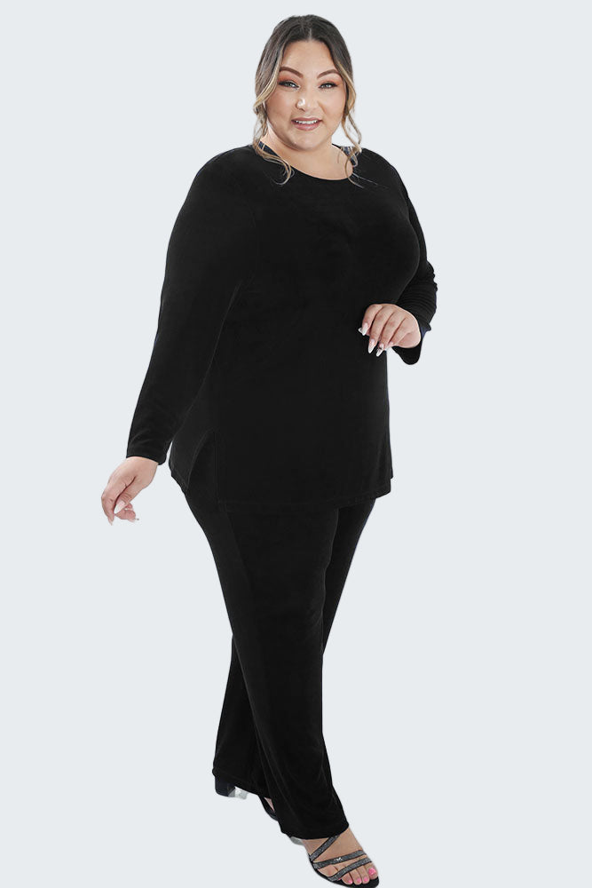 Woman wearing a black outfit on a white background