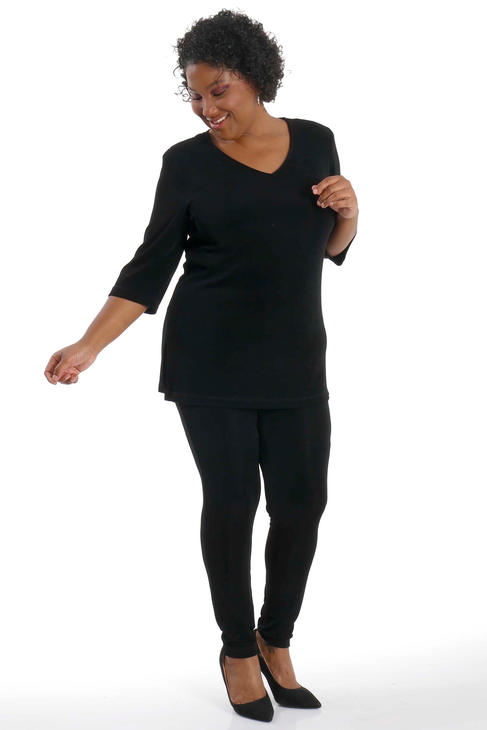 Woman wearing a black outfit on a white background