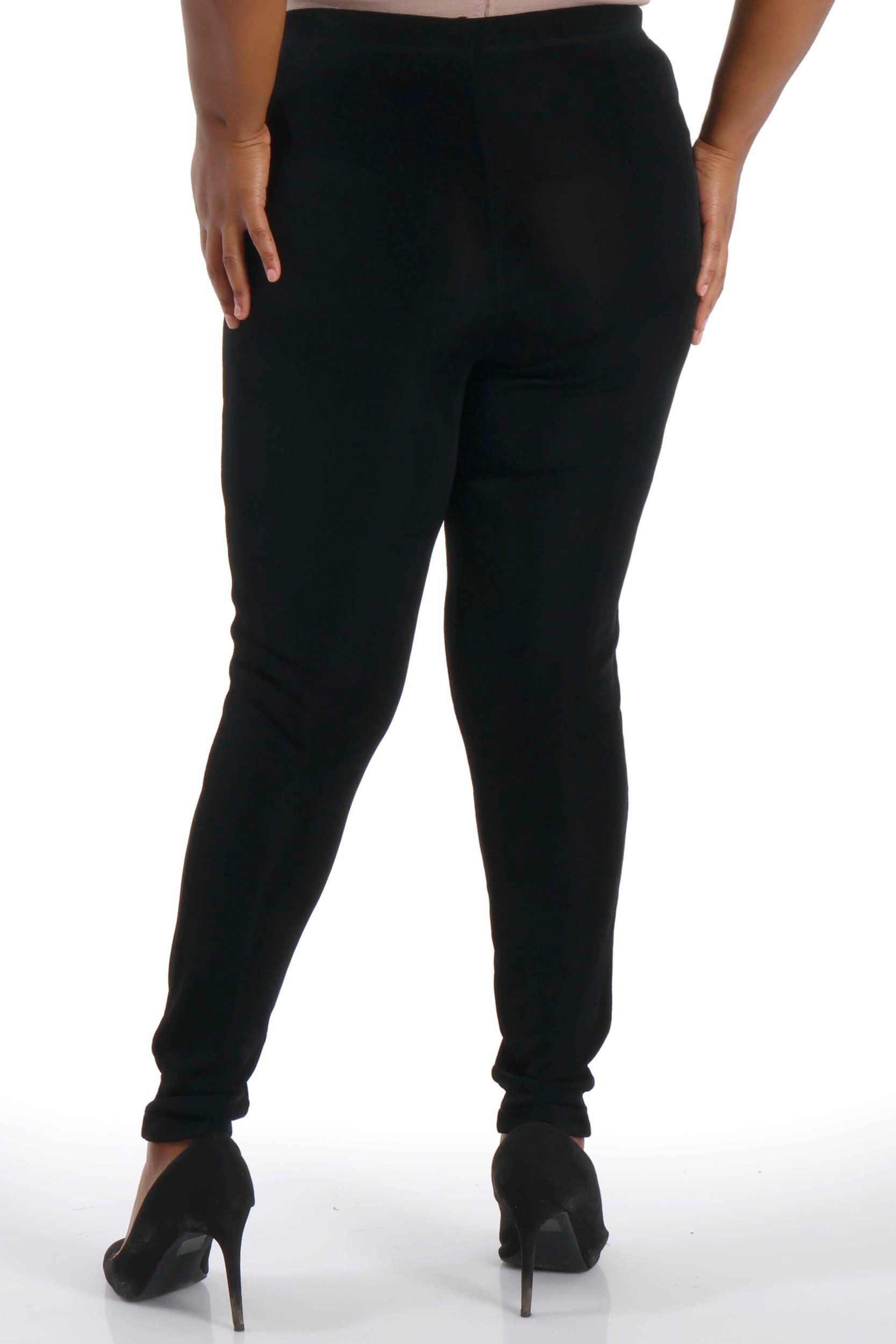 Black jogger pants worn by a person on a white background