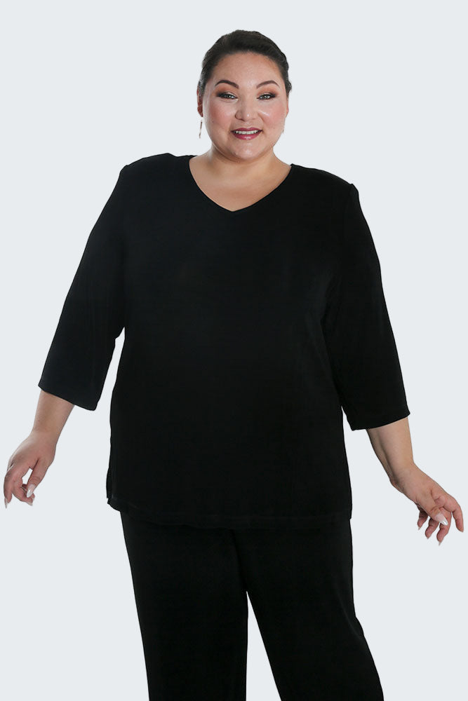Woman wearing a black outfit on a white background