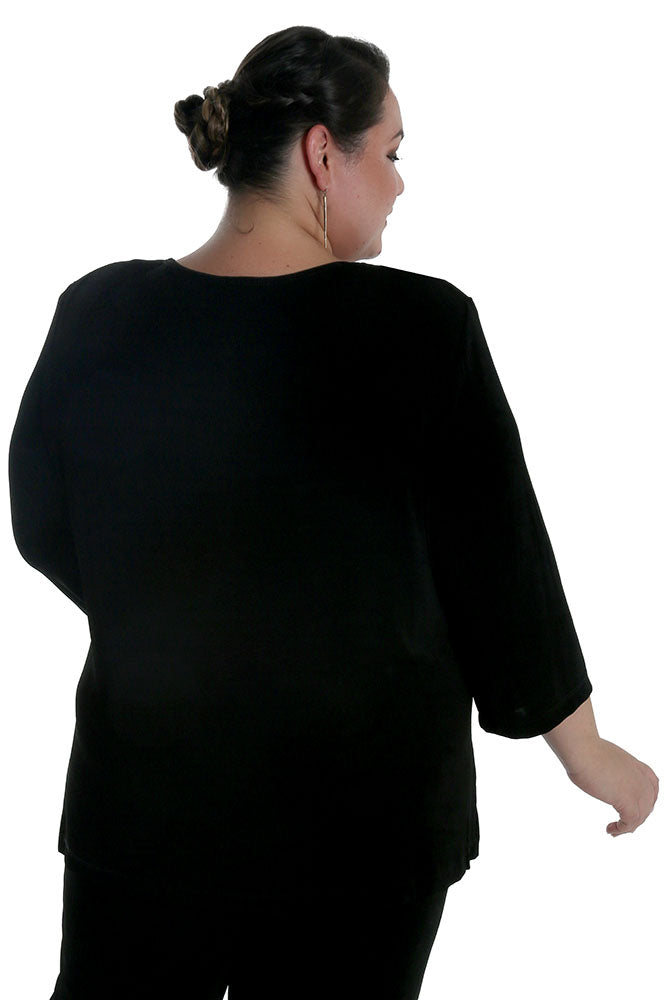 Person wearing a black outfit on a white background