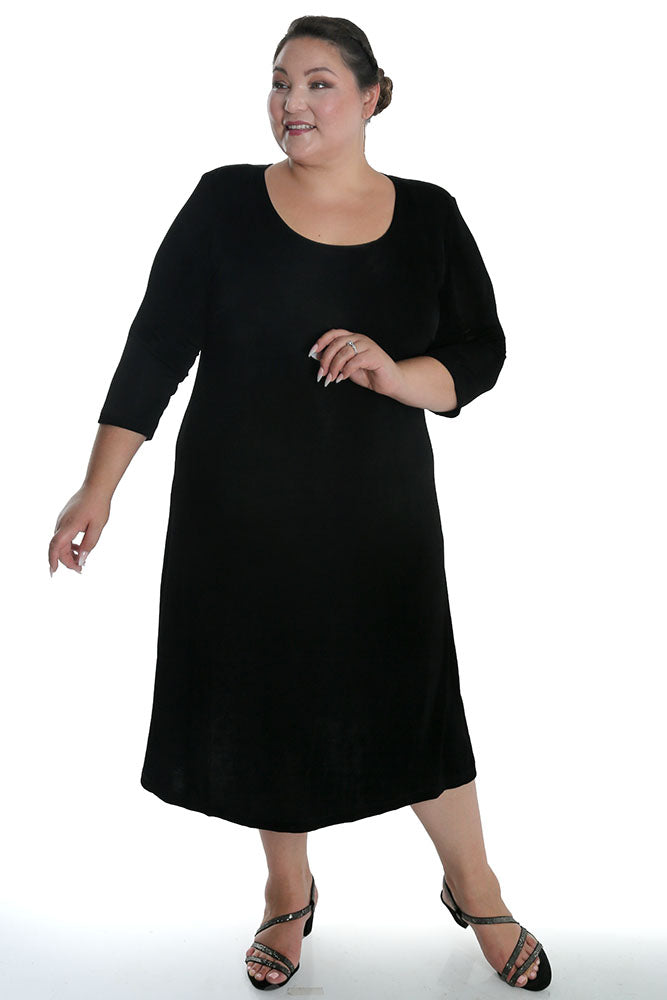 Woman wearing a black dress on a white background