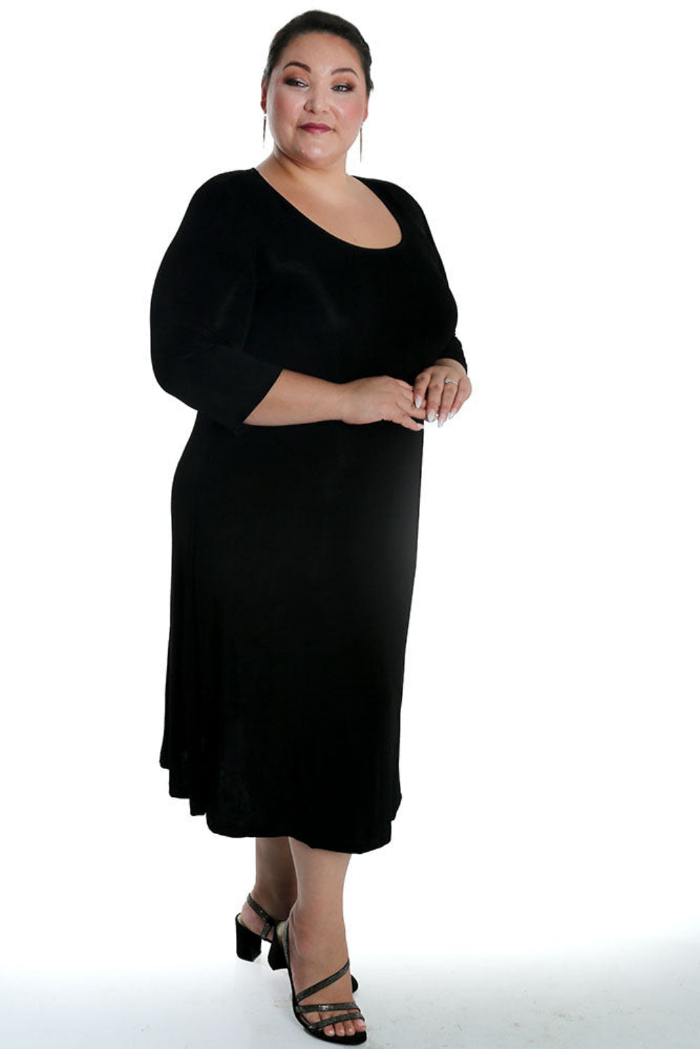 Woman wearing a black dress on a white background