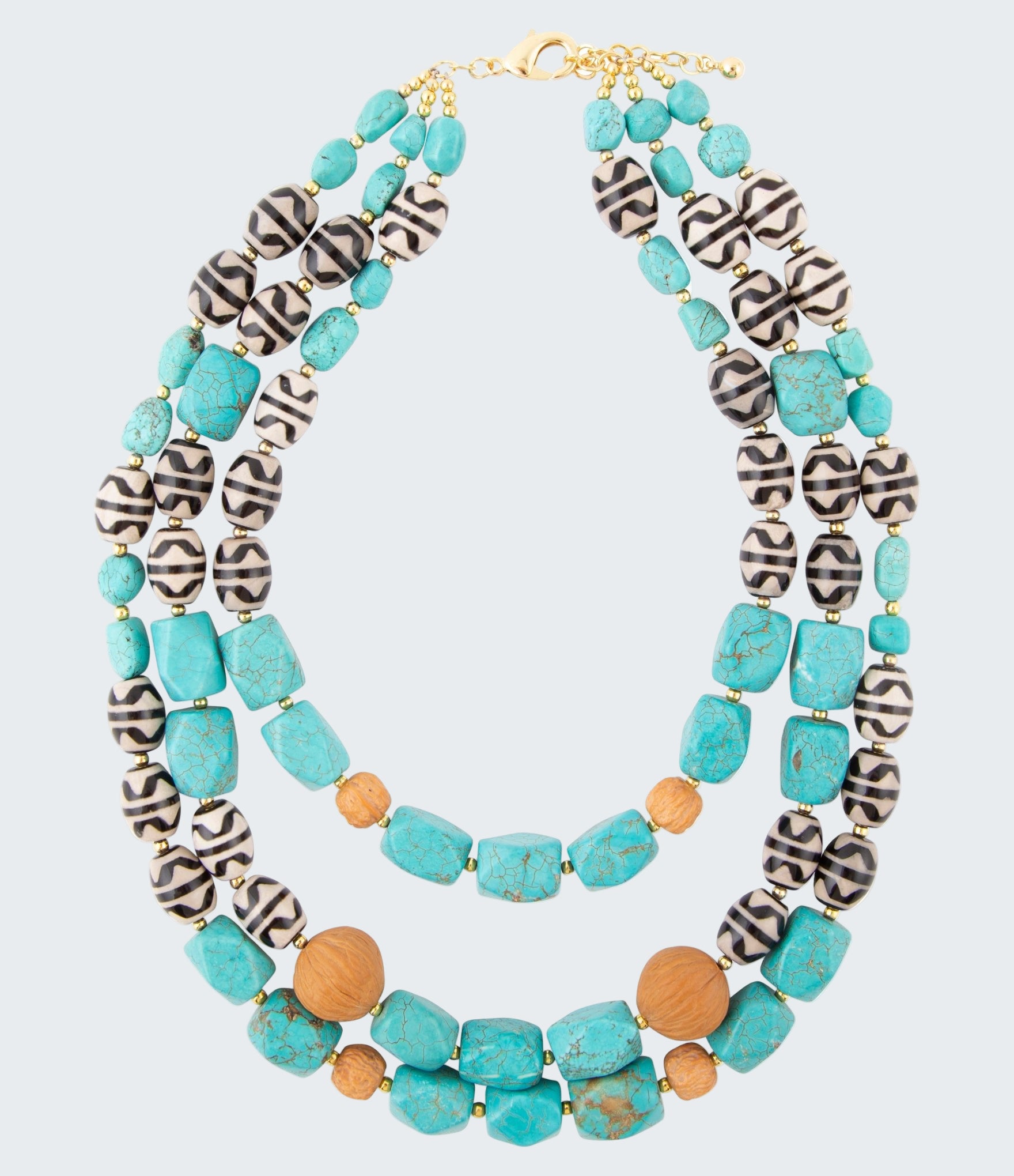 Multicolored beaded necklace with turquoise, black, and brown beads on a white background