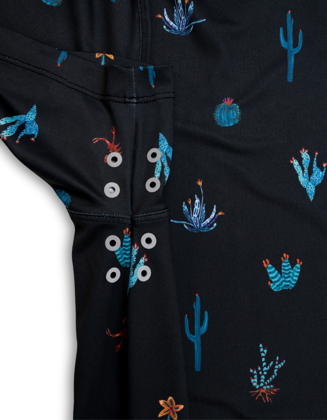 Black fabric with embroidered cactus patterns on a white background
