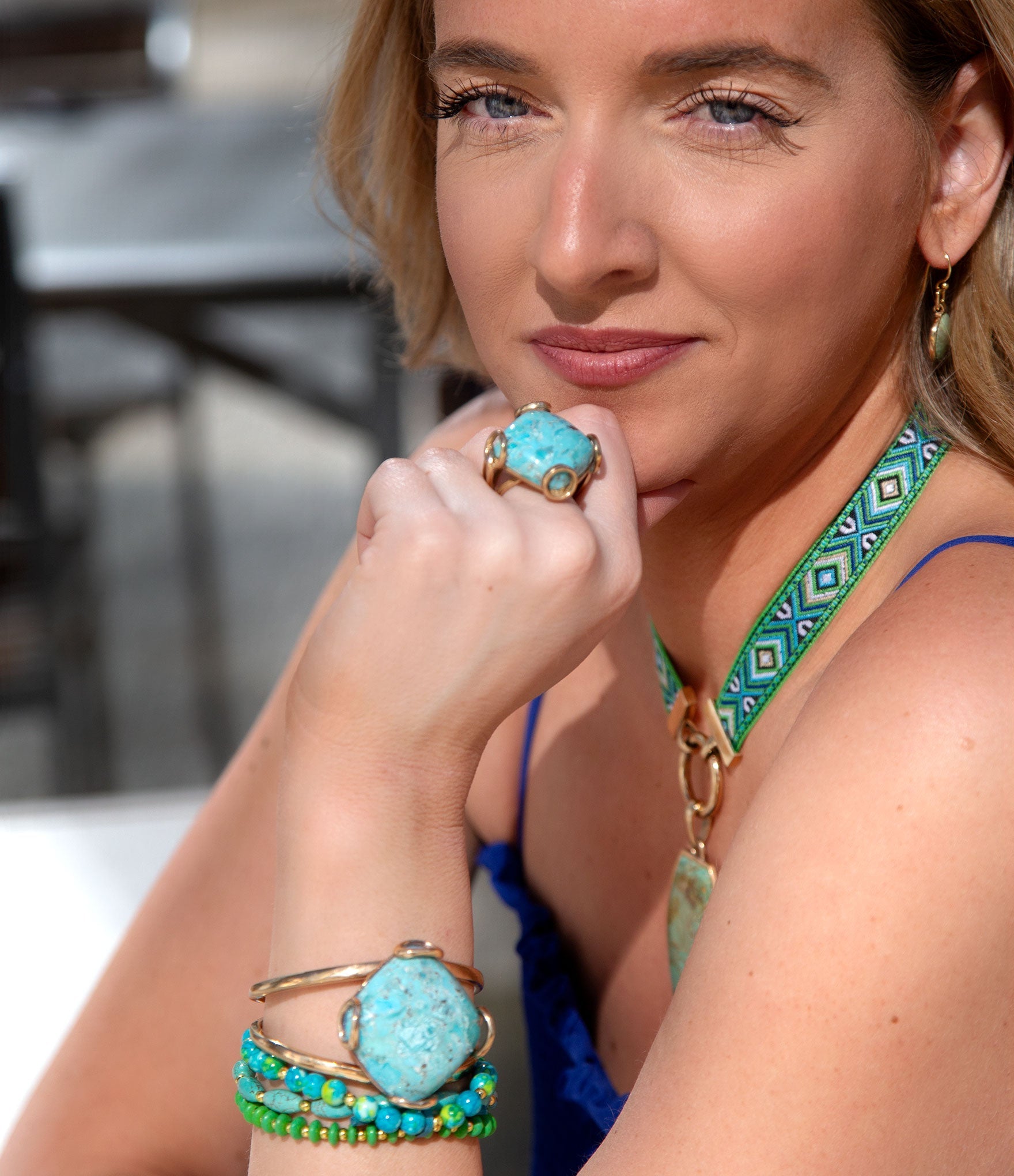 Woman wearing turquoise jewelry outdoors