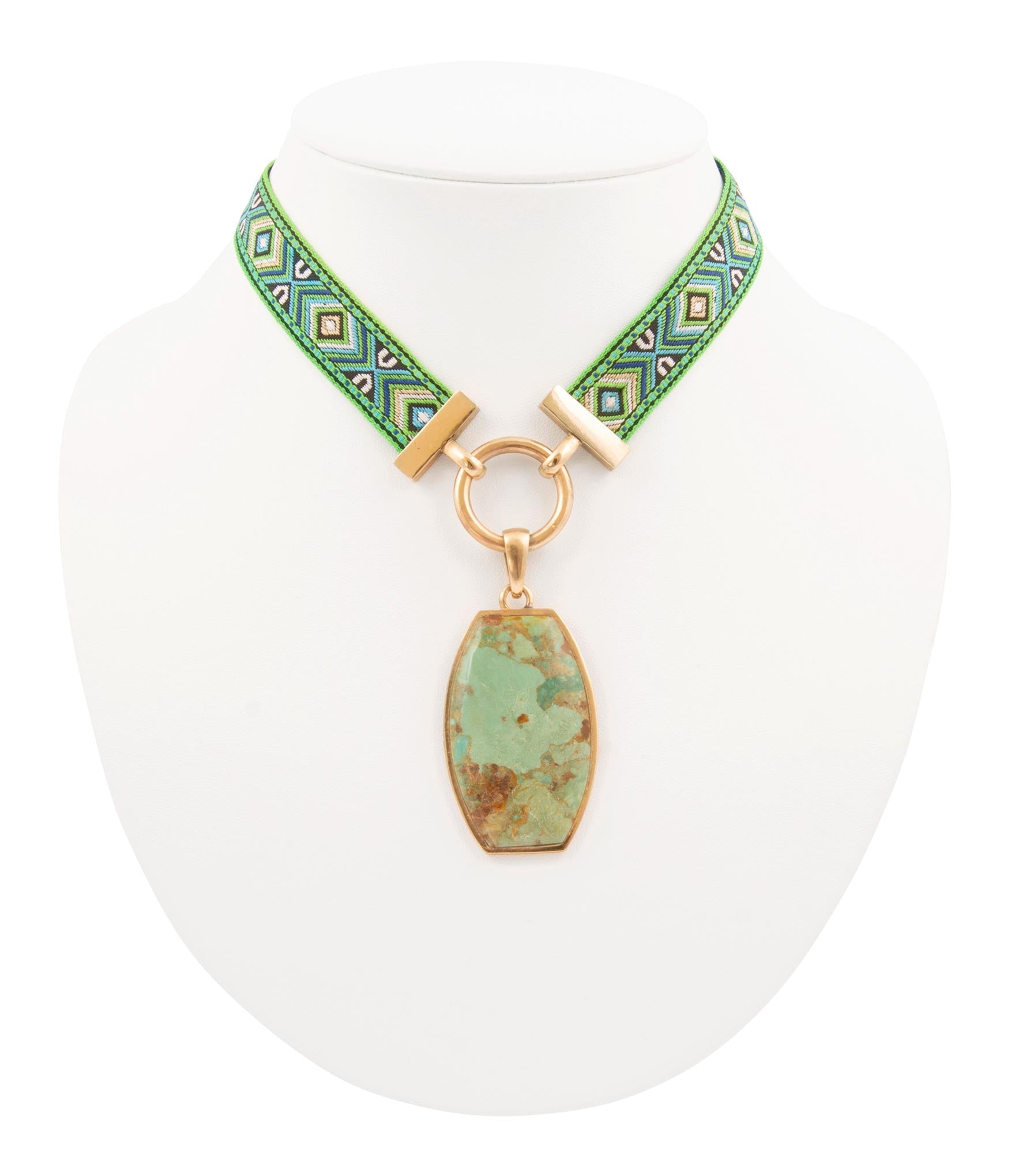 Necklace with green stone pendant and green beaded strap on a white background
