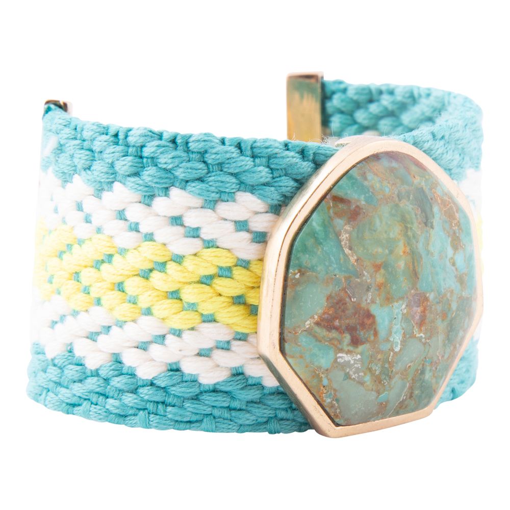 Turquoise woven bracelet with a stone-like hexagonal clasp on a white background