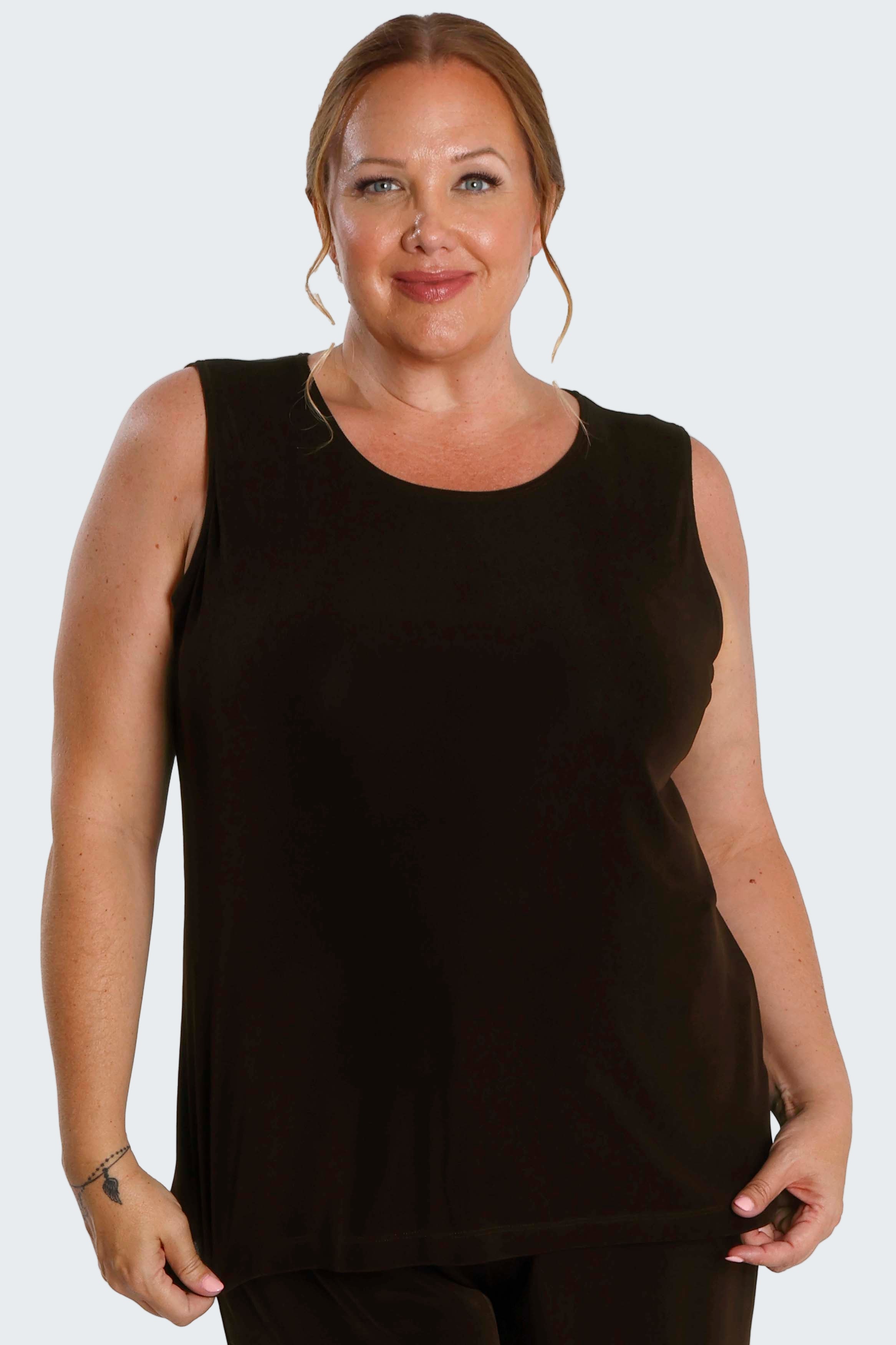 Woman wearing a black sleeveless top on a white background