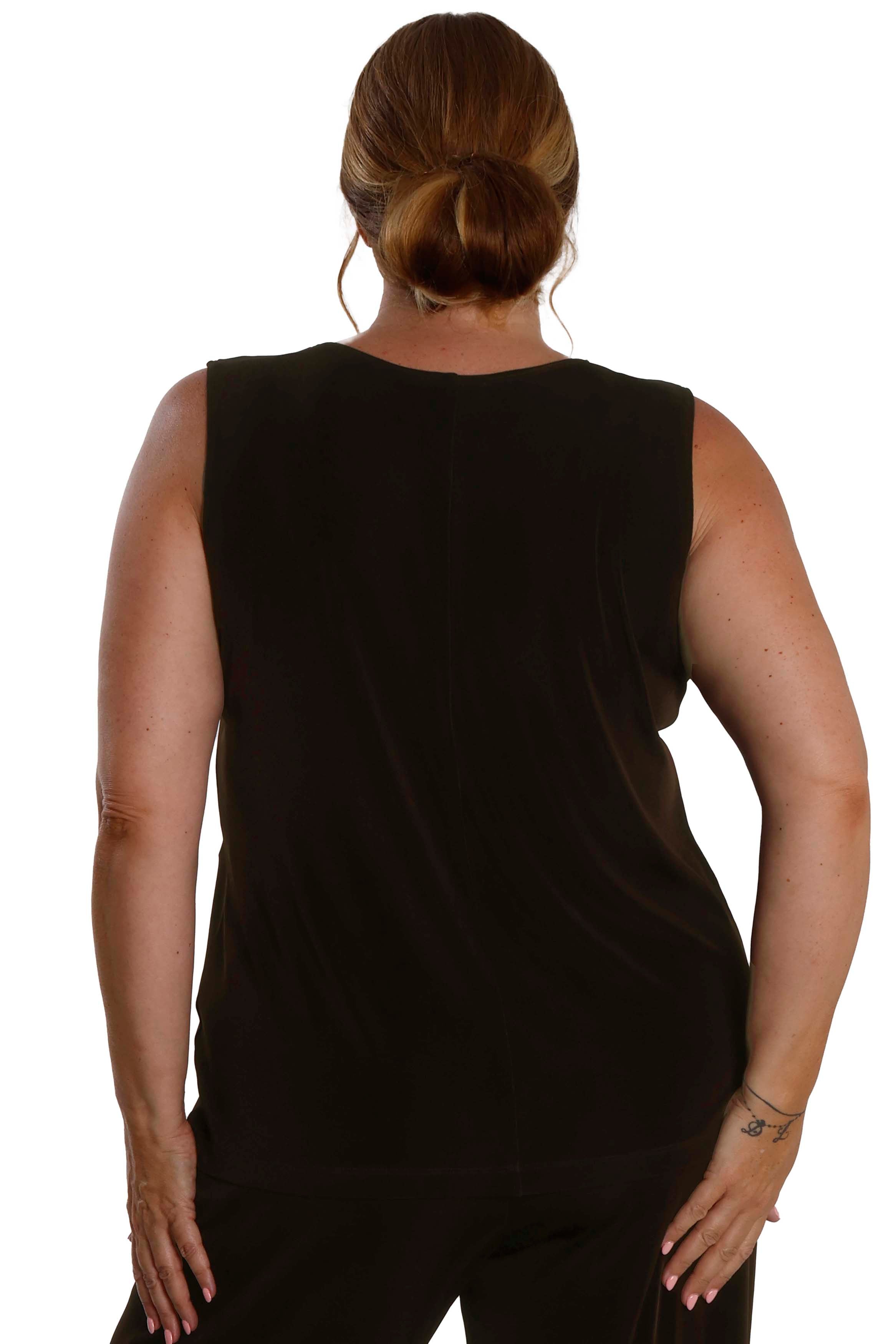Person wearing a black sleeveless top on a white background