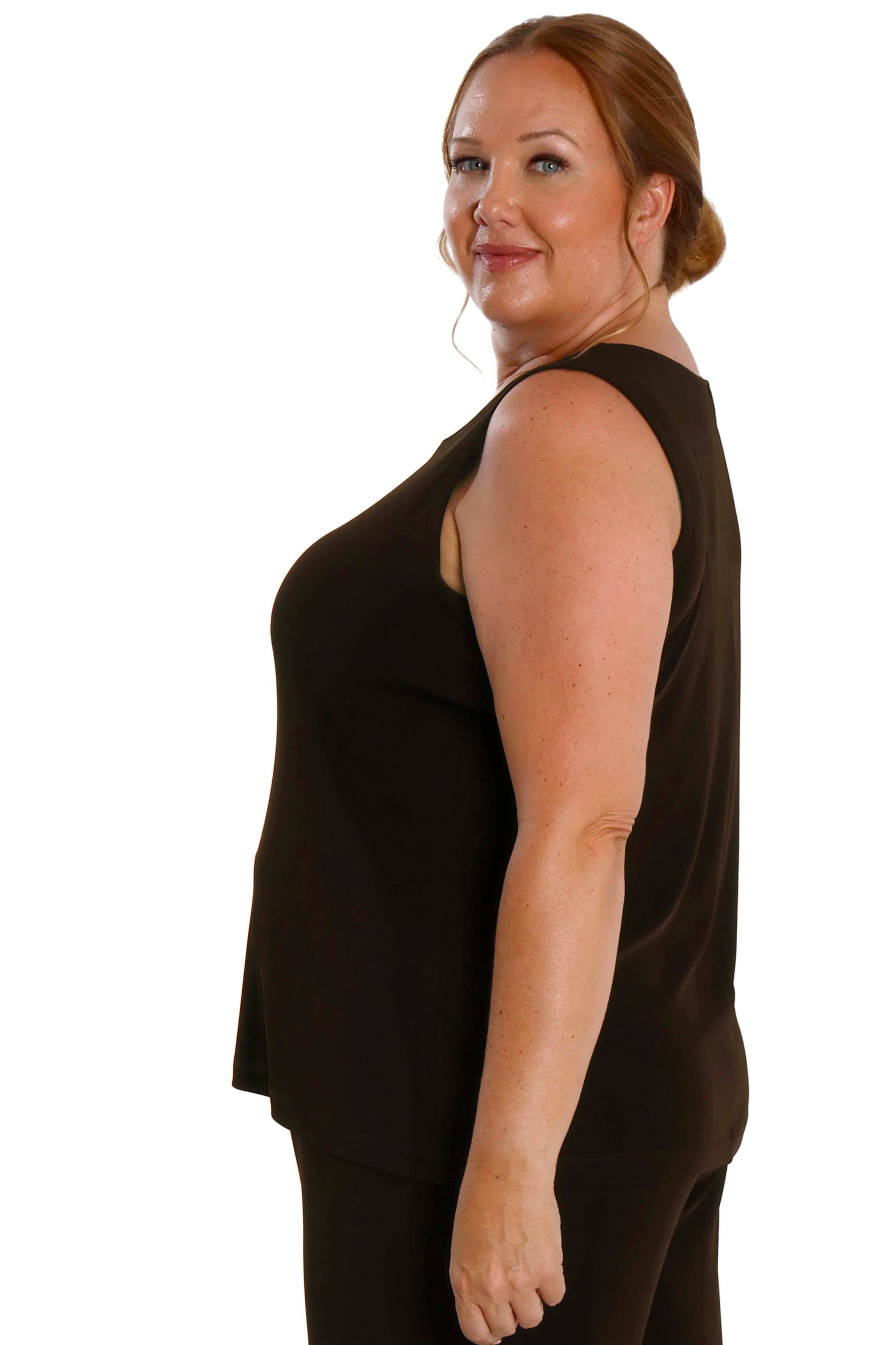 Woman wearing a black sleeveless top on a white background