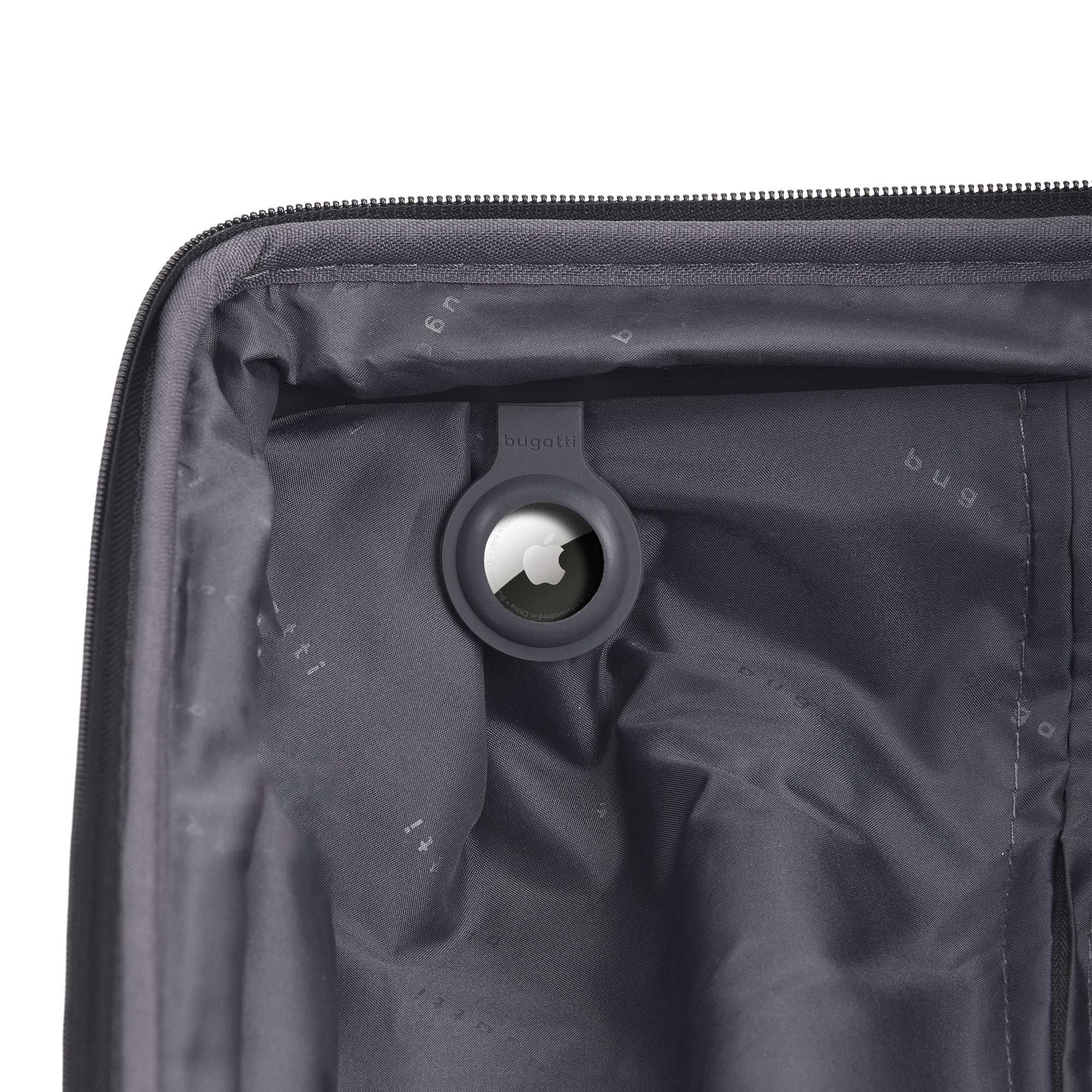 Close-up of a black suitcase with a wheel visible inside