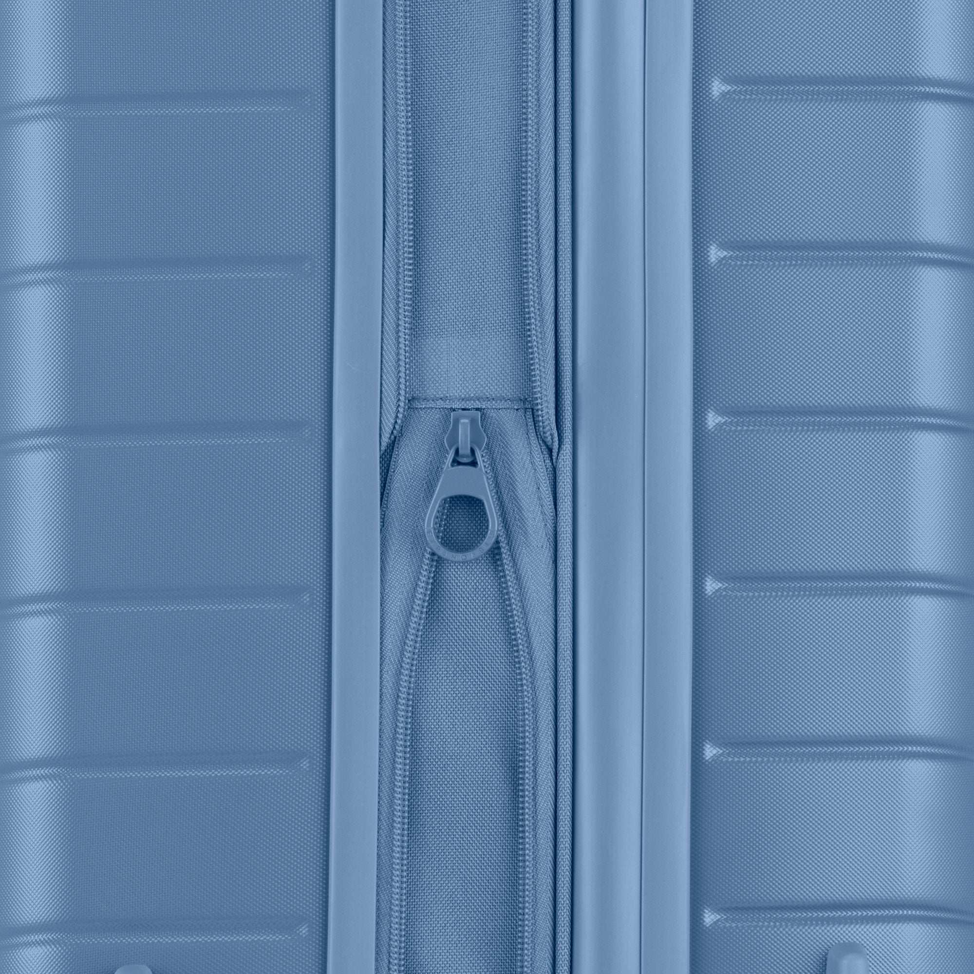 Close-up of a blue suitcase with a zipper