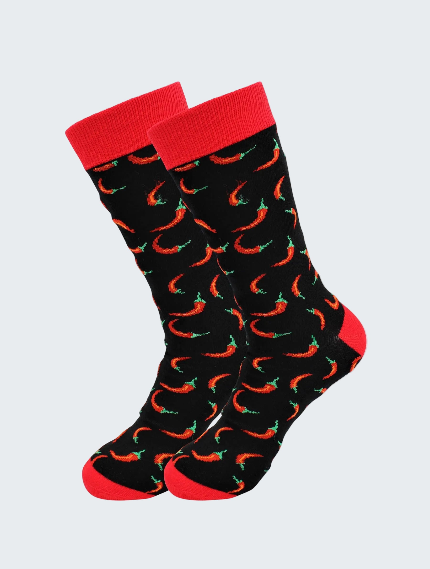 Black socks with red chili pepper pattern and red cuffs on a white background