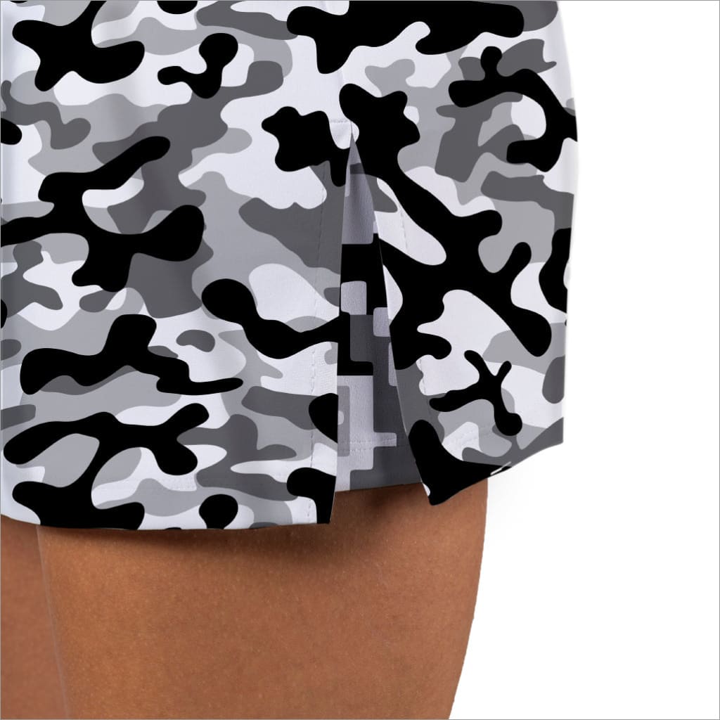 Camouflage-patterned paper table cover on a white background
