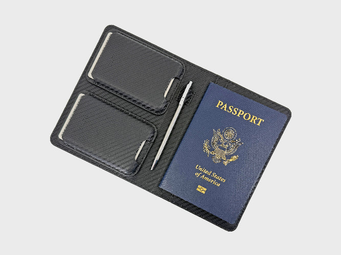 Black passport holder with a United States passport on a light gray background