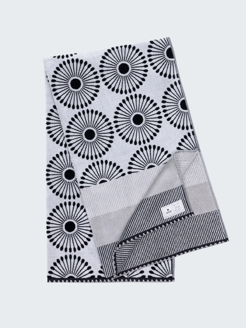 Black and white patterned towel on a white background