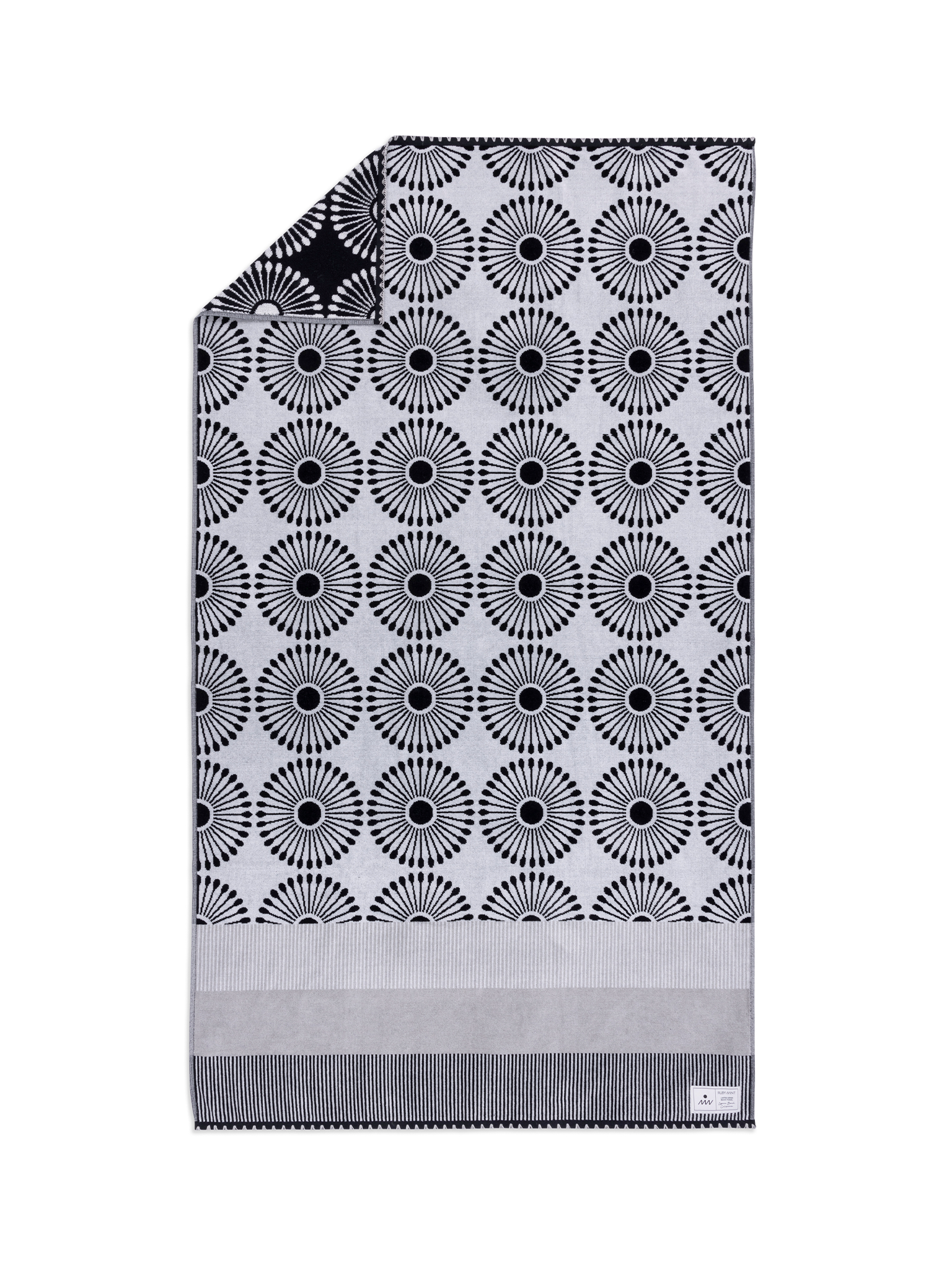 Black and white patterned blanket with a gray border on a white background