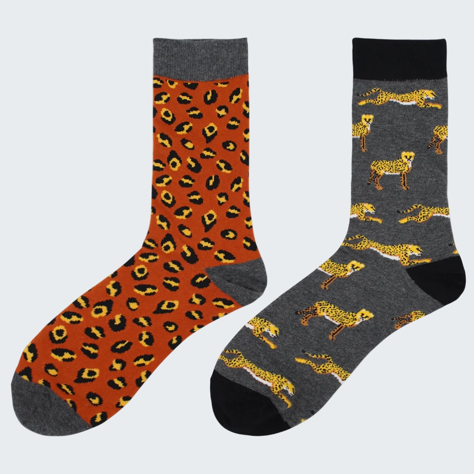 Two pairs of socks with leopard print patterns on a white background