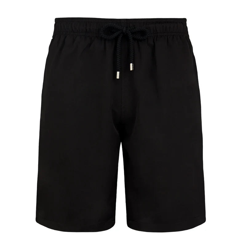 Black shorts with drawstring on a white background