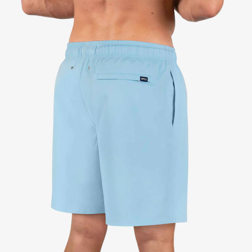 Light blue shorts worn by a person on a white background