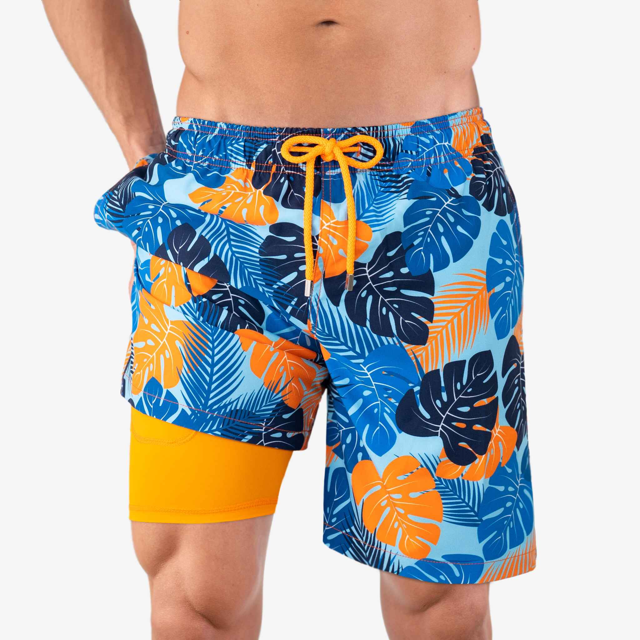 Blue and orange leaf-patterned swim shorts with a yellow drawstring on a white background
