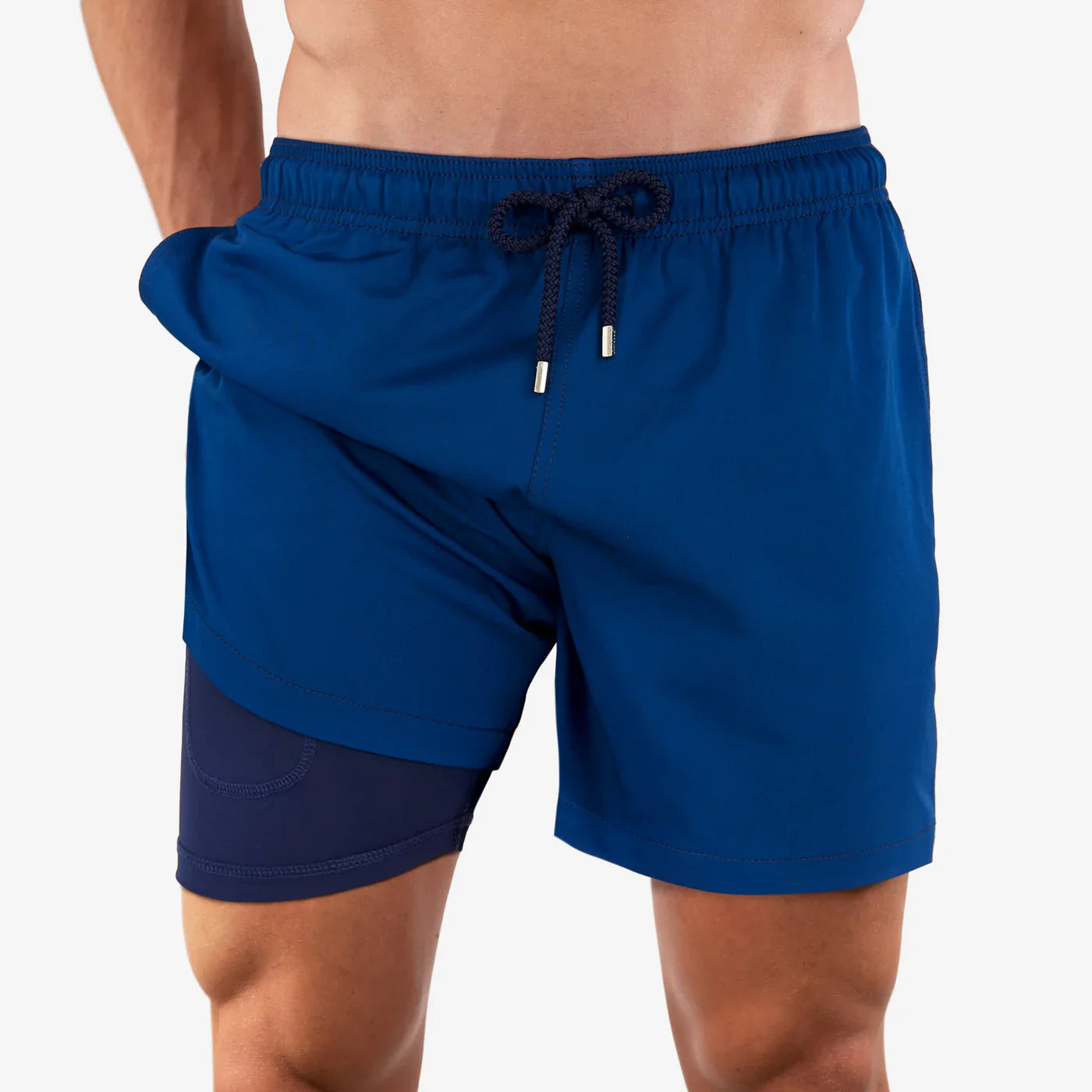 Blue athletic shorts with a drawstring on a white background