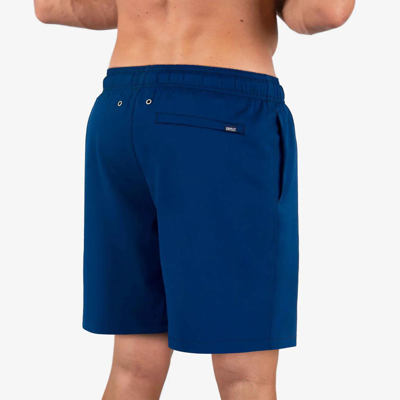 Blue shorts worn by a person on a white background