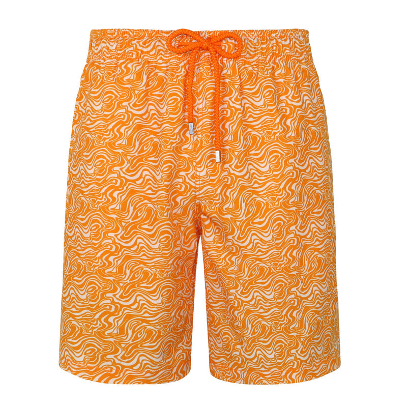 Orange swim shorts with a pattern on a white background