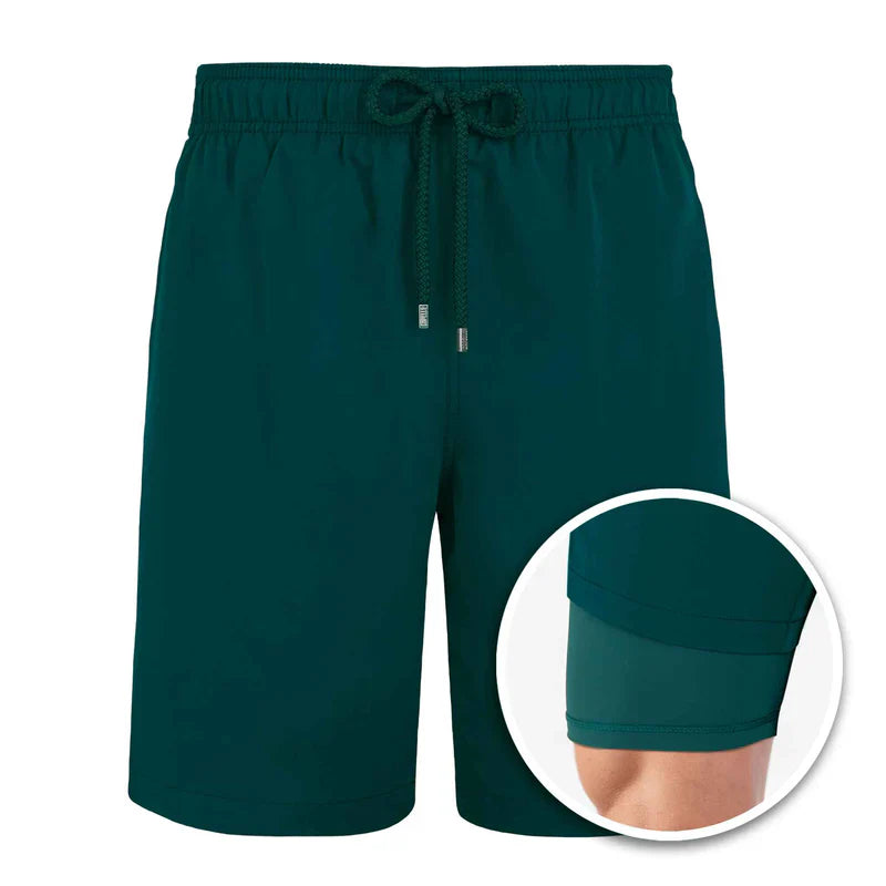 Green shorts with drawstring on a white background