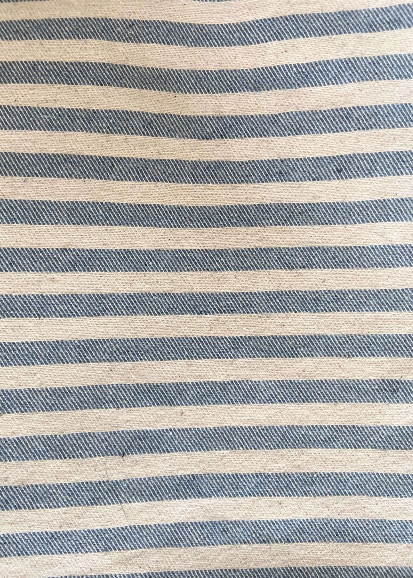 Close-up of blue and beige striped fabric
