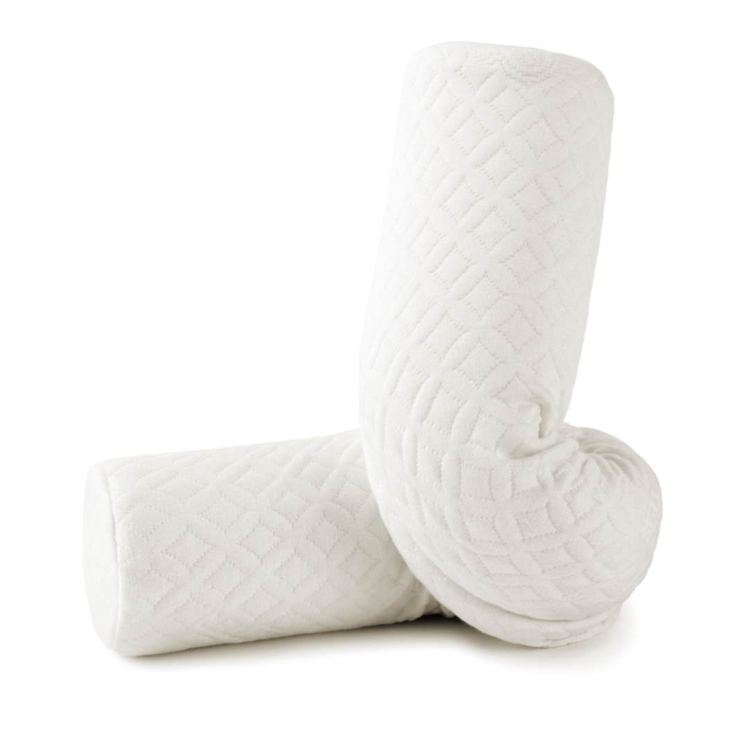 Two white quilted pillows on a white background