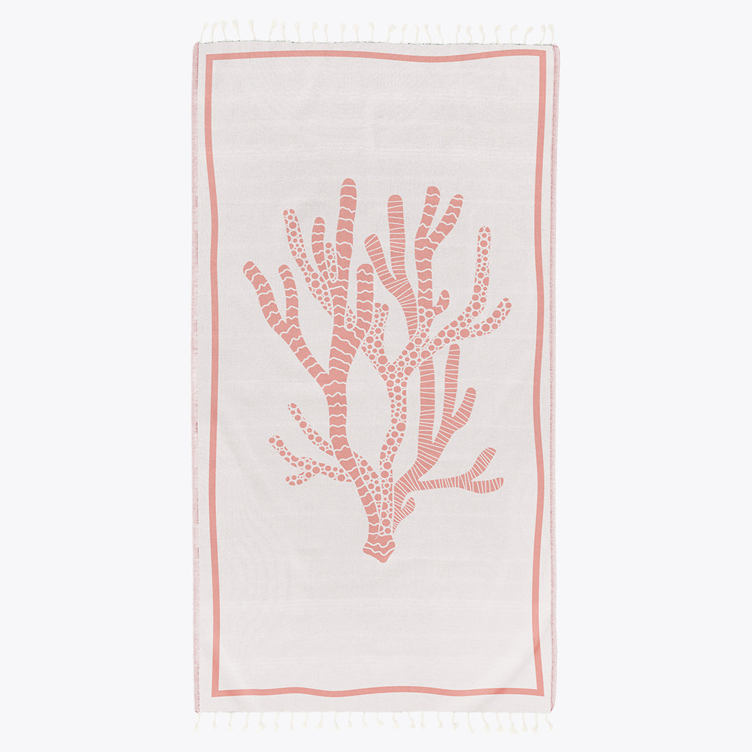 Beach towel with coral design on a white background
