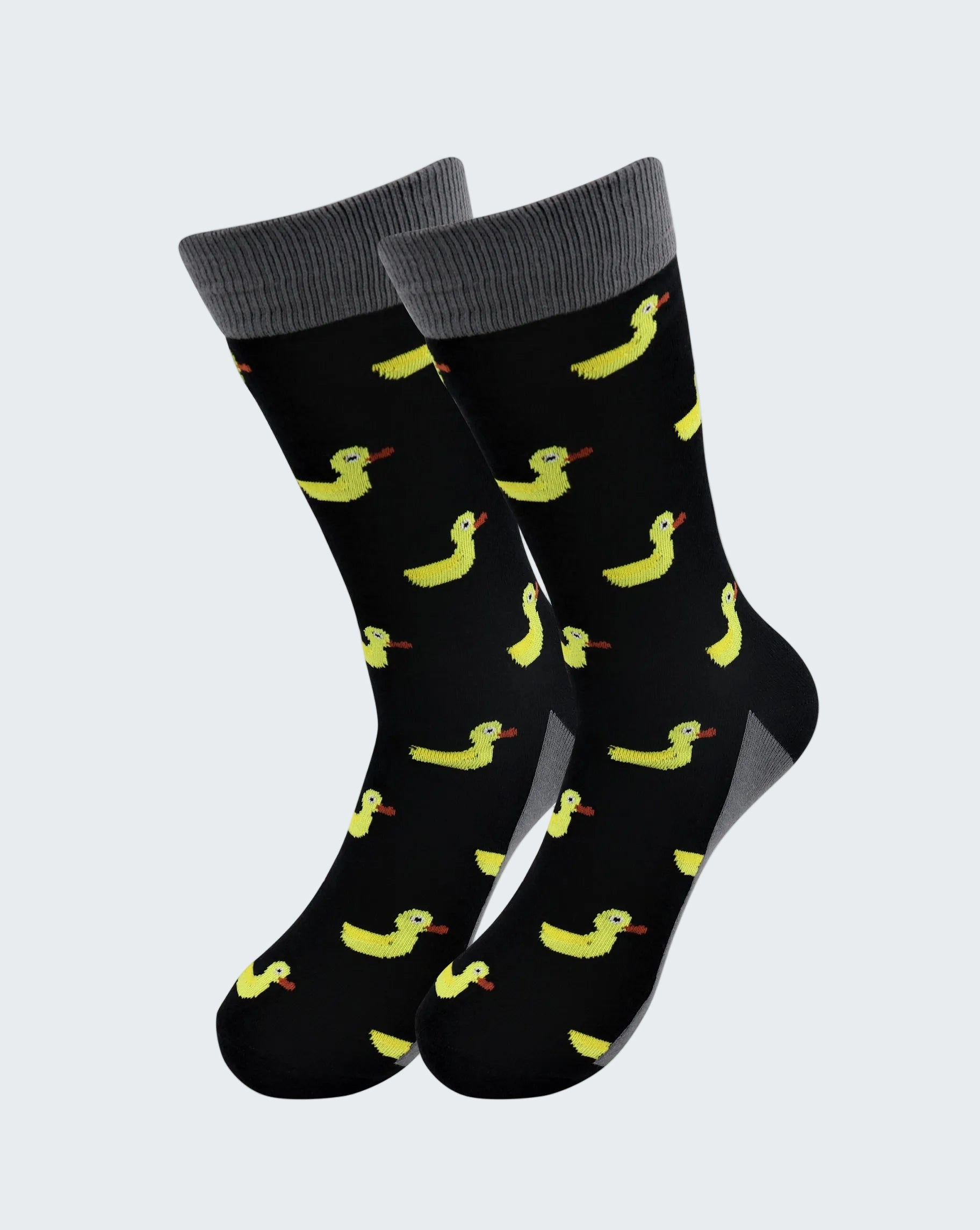 Black socks with yellow duck pattern on a white background