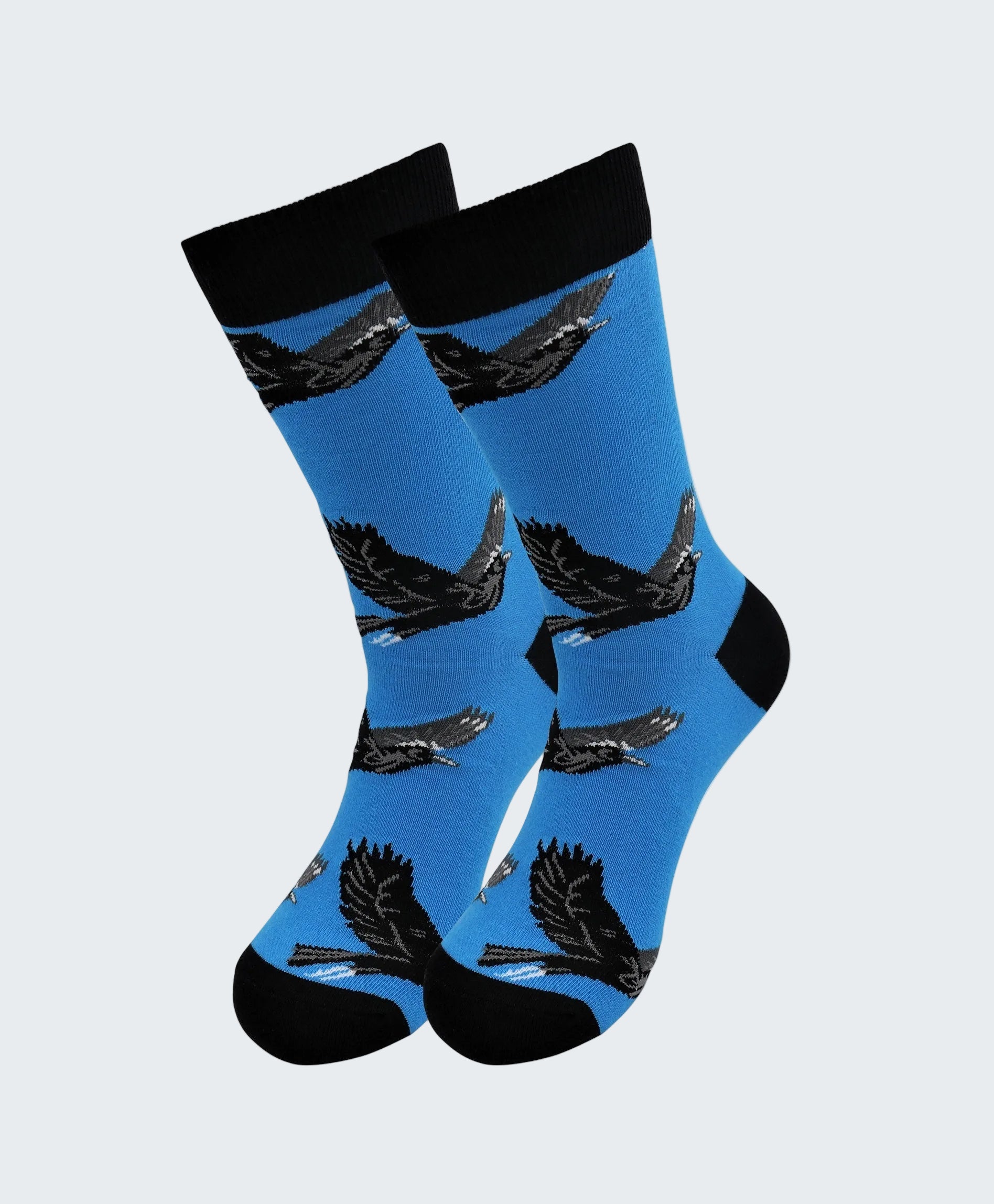 Blue socks with black eagle designs on a white background