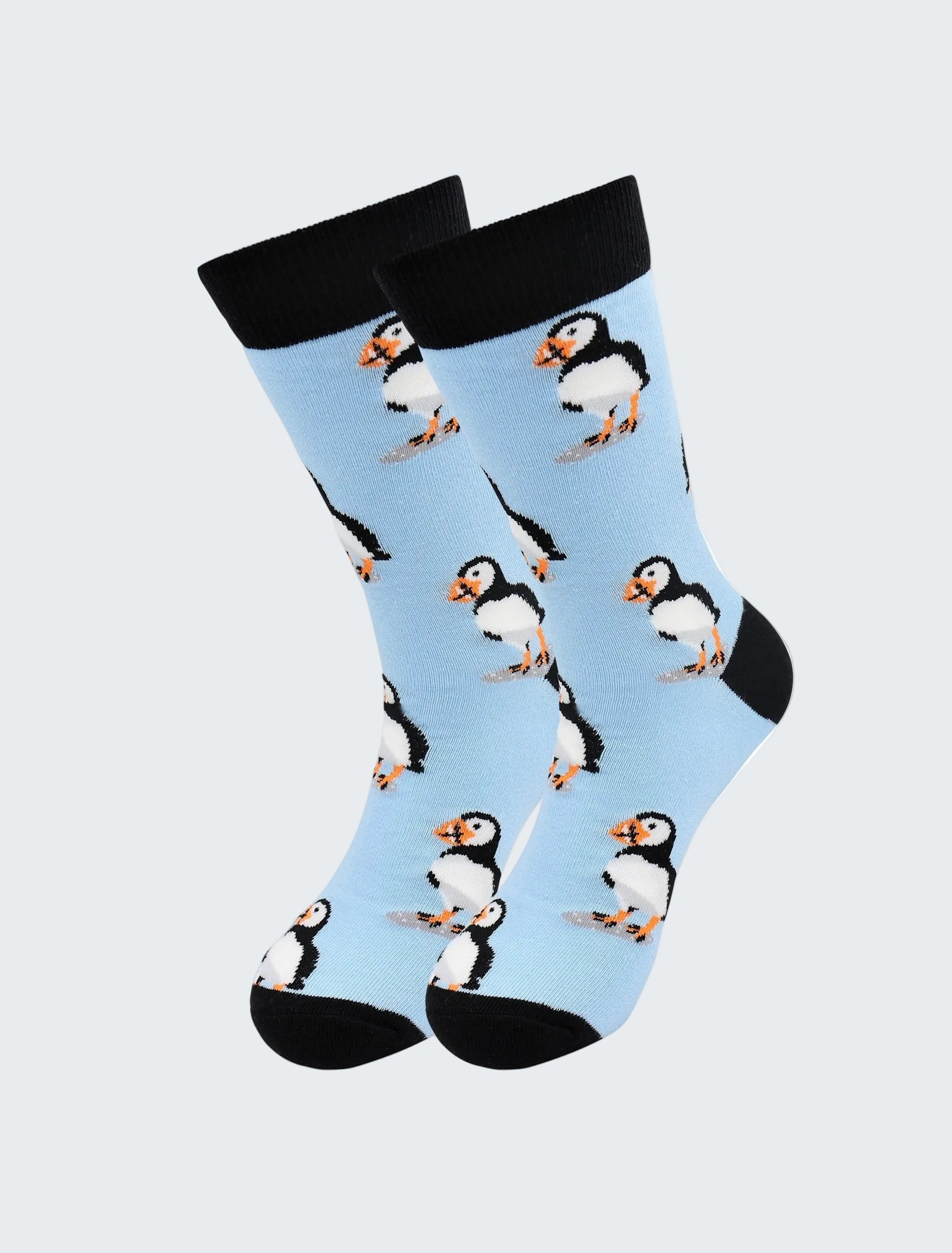 Socks with puffin pattern on a light blue background
